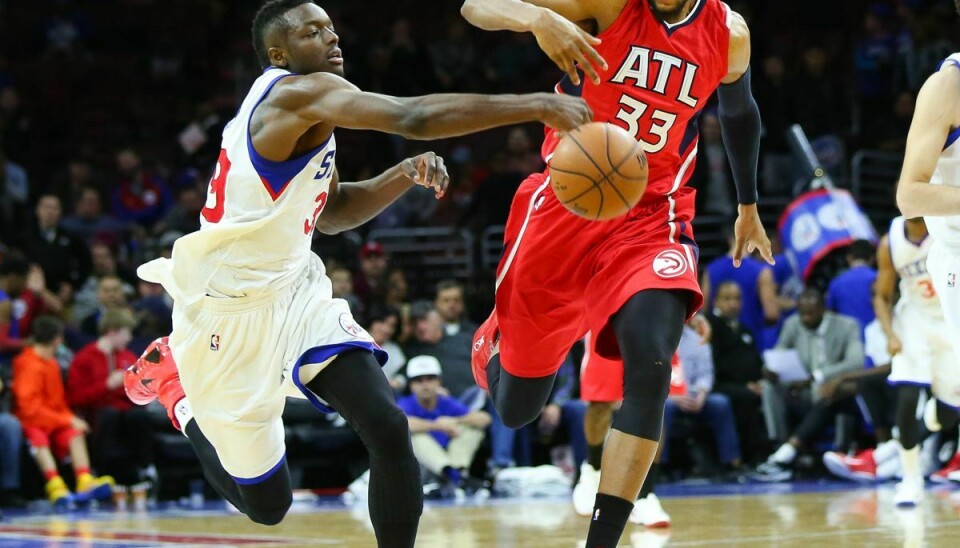 Adreian Payne til højre nåede at spille fem sæsoner i NBA.