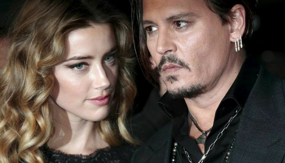 Johnny Depp og hans kone Amber Heard er nu nået til enighed i skilsmissesagen. Foto: SUZANNE PLUNKETT/Scanpix (Arkivfoto)