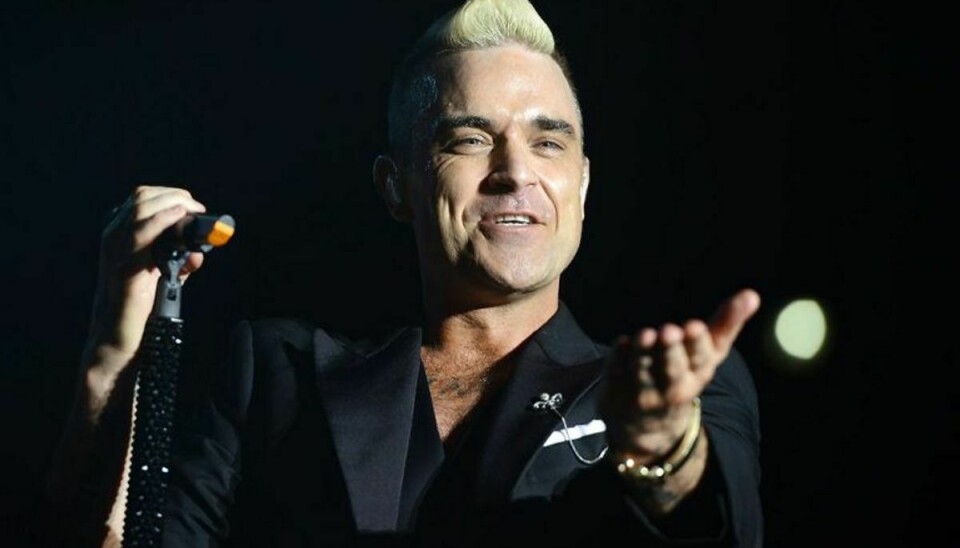 Vild med dans får fredag besøg af Robbie Williams. Foto: JEAN-PIERRE AMET/Scanpix (Arkivfoto)