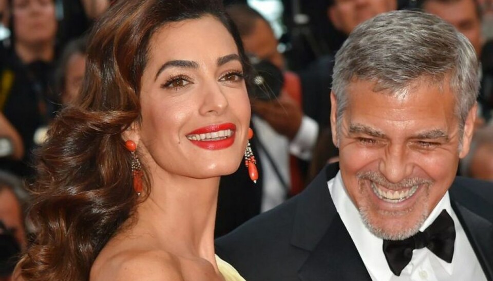 Clooney-parret donerer millioner til bekæmpelse af vold Amal og George Clooney vil stoppe volden. Foto: LOIC VENANCE/Scanpix (Arkivfoto)