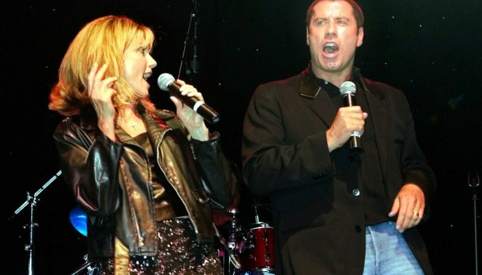 Det var John Travolta og Olivia Newton-John, der havde hovedrollerne som Danny Zuko og Sandy Olsson i Greace. Filmen var i høj grad med til at gøre dem til de verdensstjerne, de er. Klik videre i galleriet for flere billeder. Foto: Scanpix/REUTERS/Fred Prouser Det var John Travolta og Olivia Newton-John, der havde hovedrollerne som Danny Zuko og Sandy Olsson i Greace. Filmen var i høj grad med til at gøre dem til de verdensstjerne, de er. Klik videre i galleriet for flere billeder. Foto: Scanpix/REUTERS/Fred Prouser