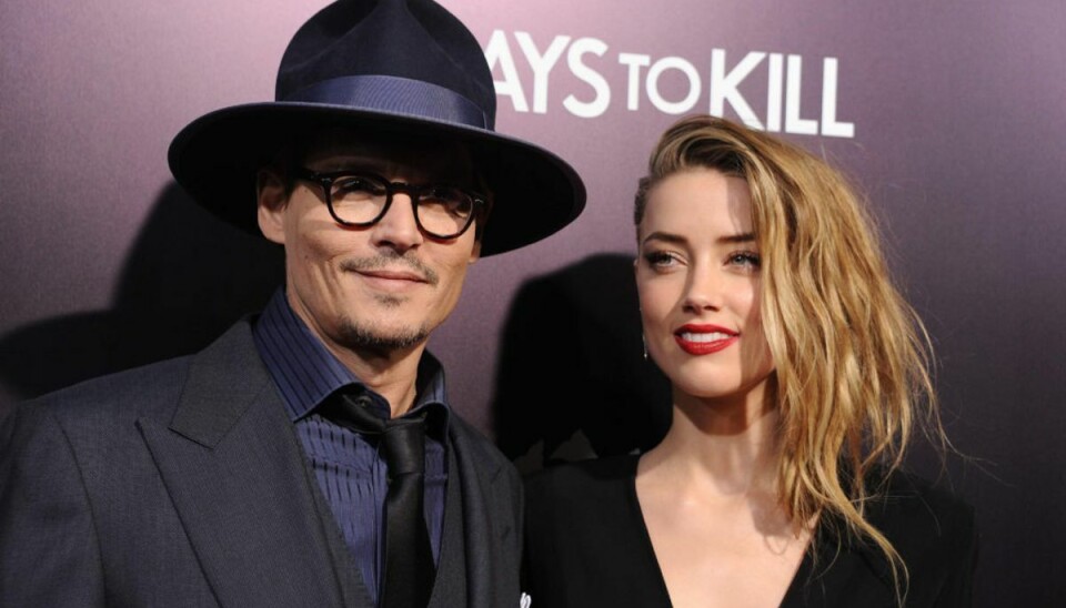 Hollywoodstjernen Johnny Depp har mandag tabt en retssag i London mod den britiske tabloidavis The Sun. Den 57-årige skuespiller havde lagt sag an mod The Sun for bagvaskelse, efter at avisen havde skrevet, at han var skyldig i “hustruvold” mod sin ekskone Amber Heard. (Arkivfoto af parret, da de stadig var sammen i 2014) – Foto: Robyn Beck/Ritzau Scanpix.